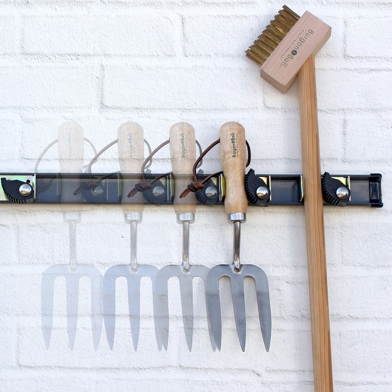 Garden Tools Hanging on Tool Rack