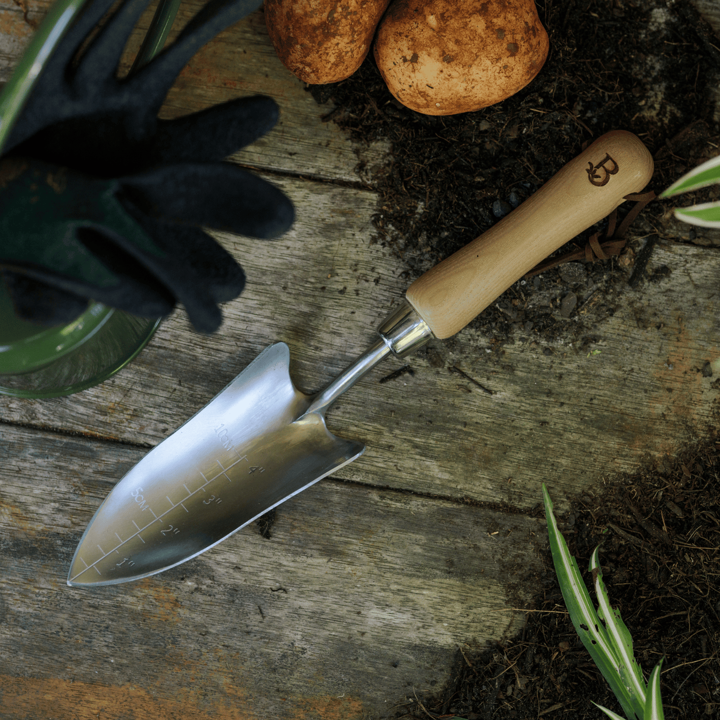 Garden Hand Transplanter on Potting Bench