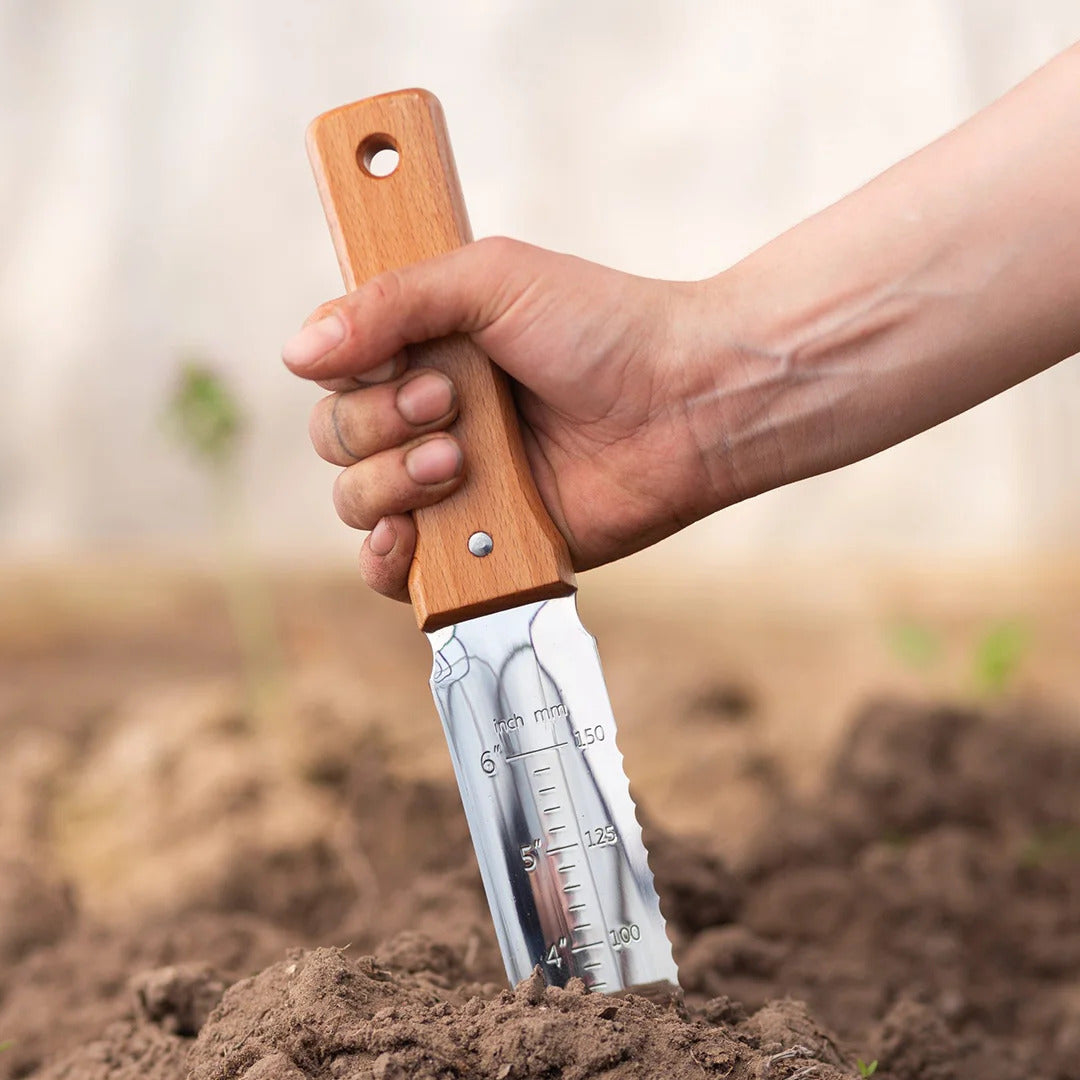Nisaku Hori Hori Knife in Soil with Inch Markings