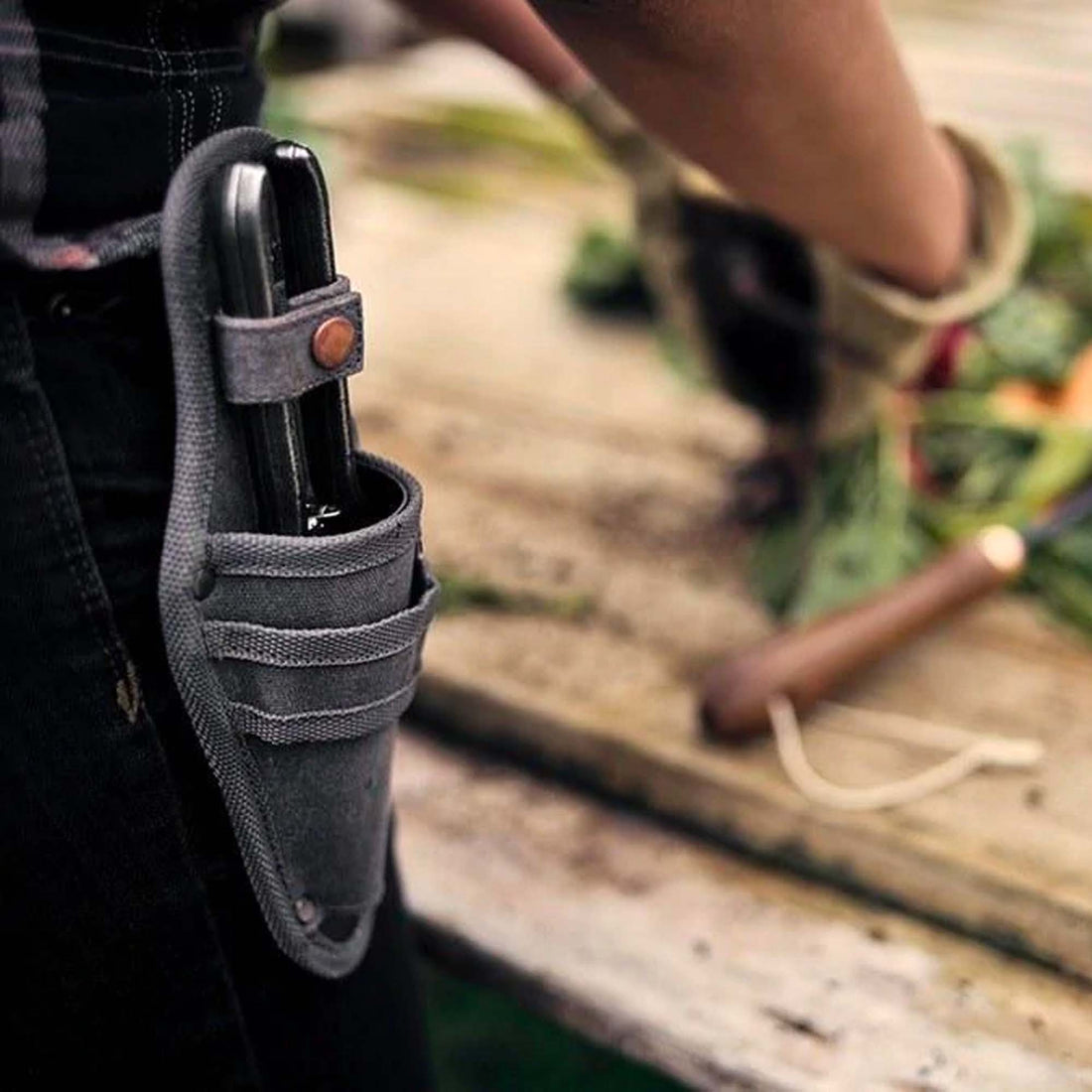 Gardener wearing Barebones Pruner in Sheath/