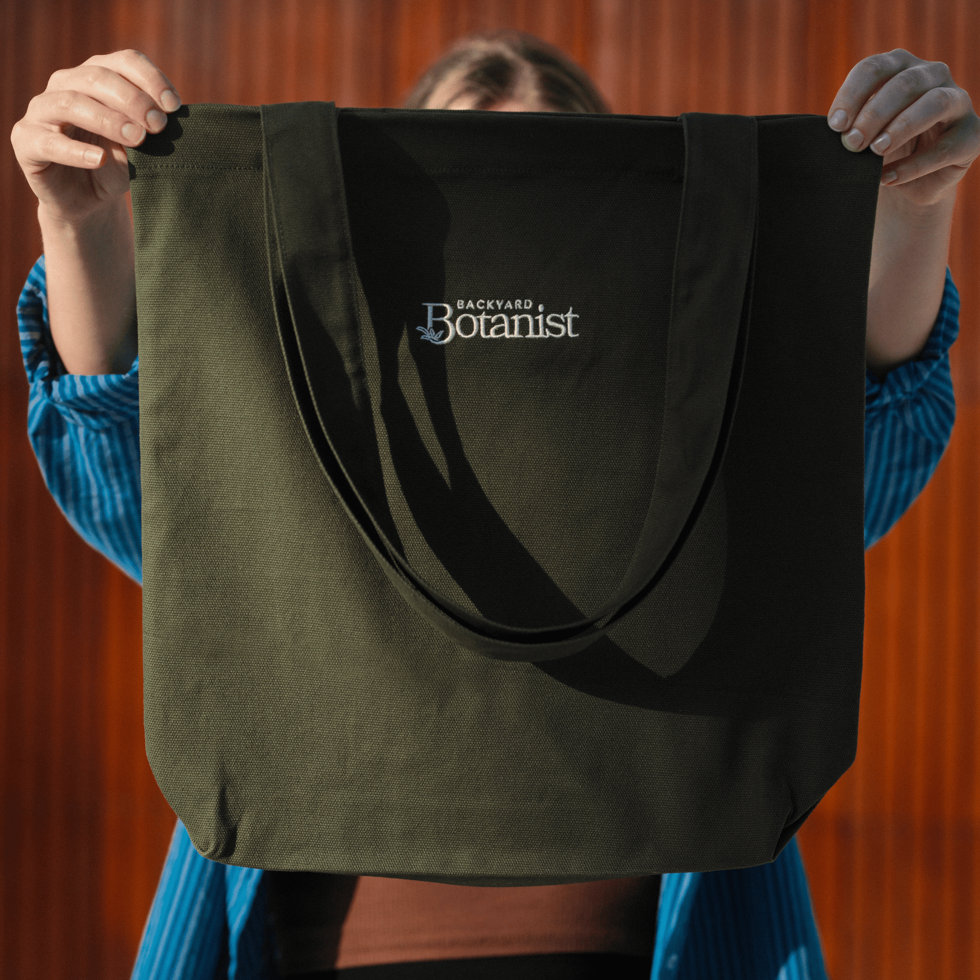 Backyard Botanist Tote Bag Held Up