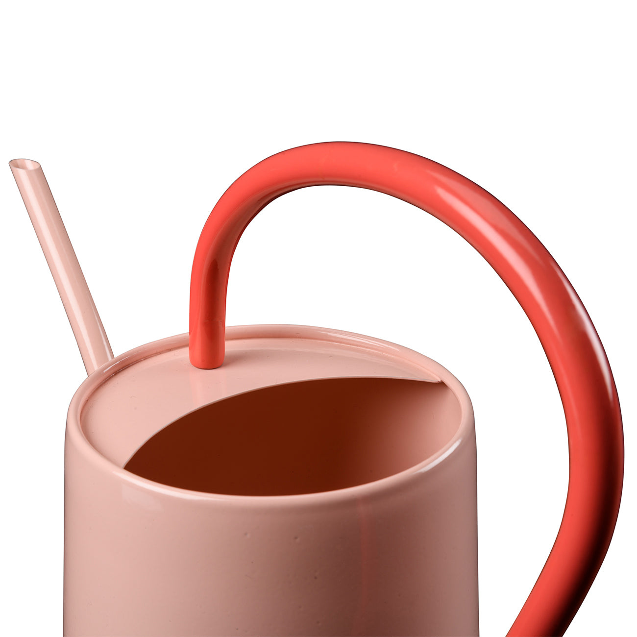 Pink watering can with red handle.