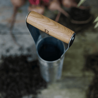 Ash wood handle with 'B' engraving on bulb planter.