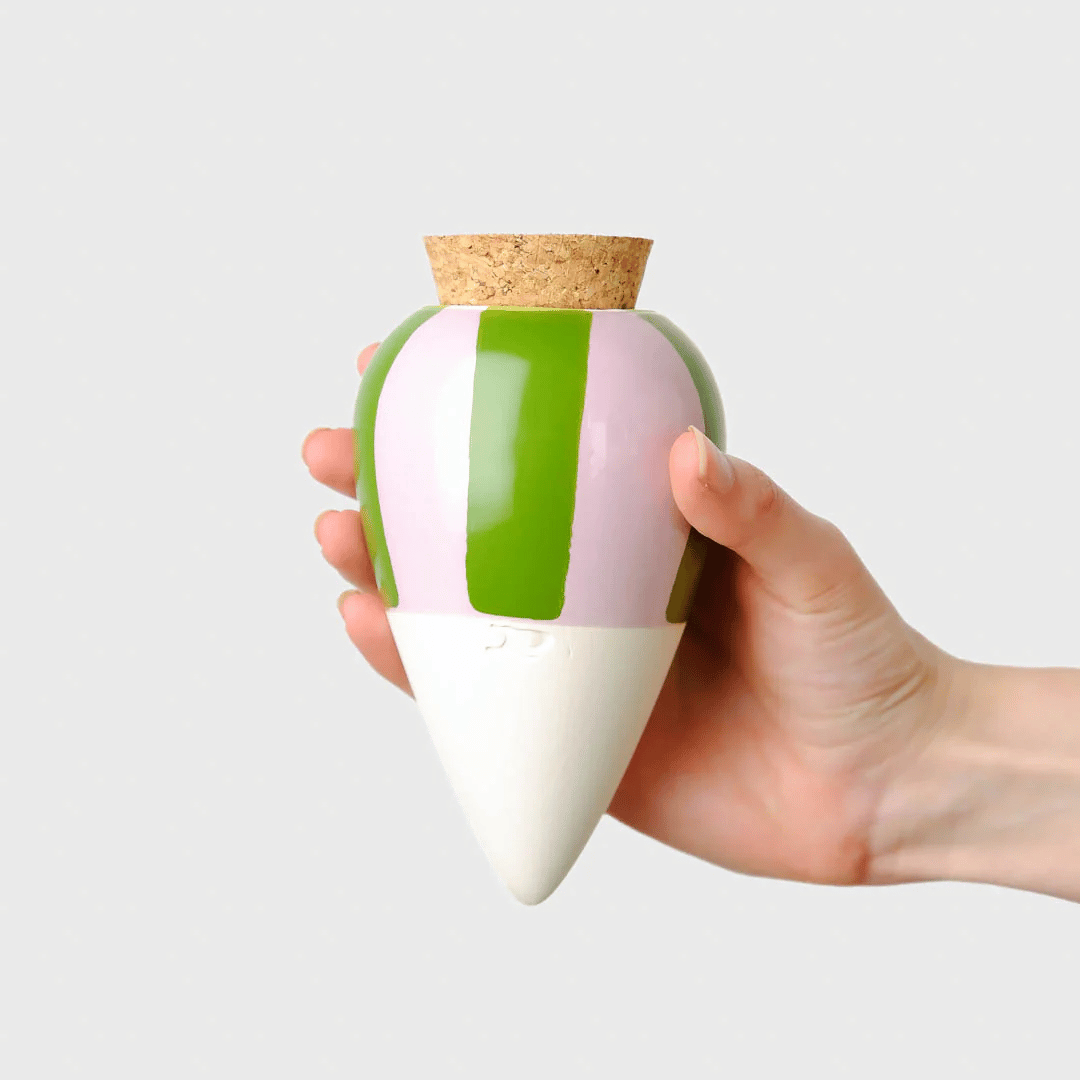 Hand holding green & lilac striped Pepin Olla.