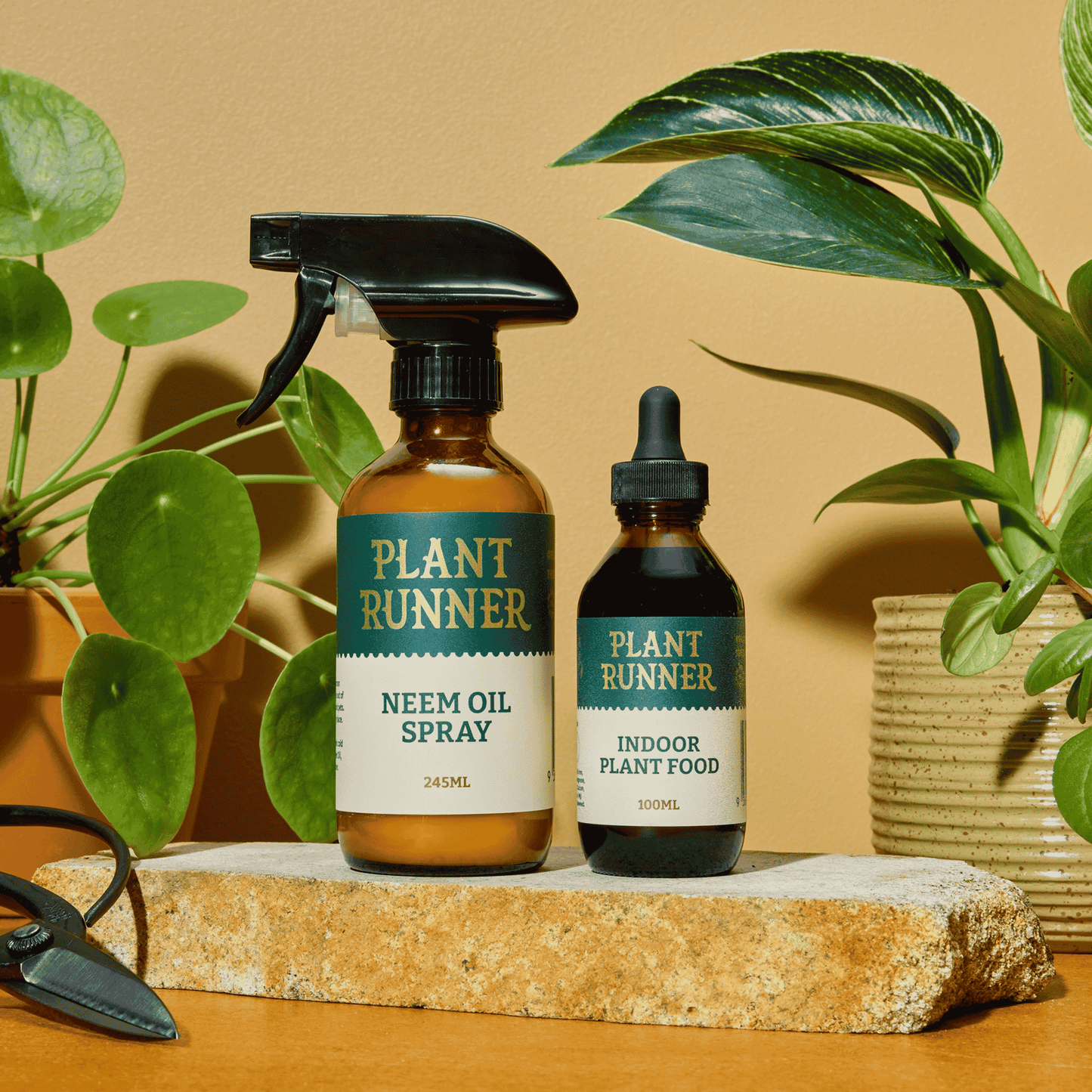 Plant Runner Neem Oil & Indoor Plant Food Bottles on Slab