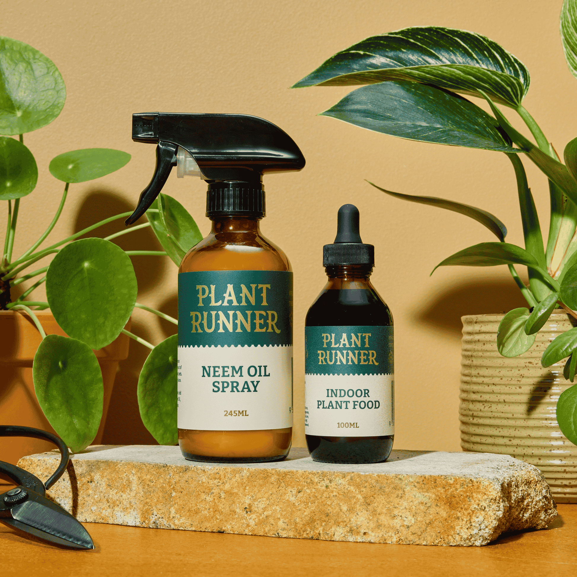 Plant Runner Neem Oil & Indoor Plant Food Bottles on Slab