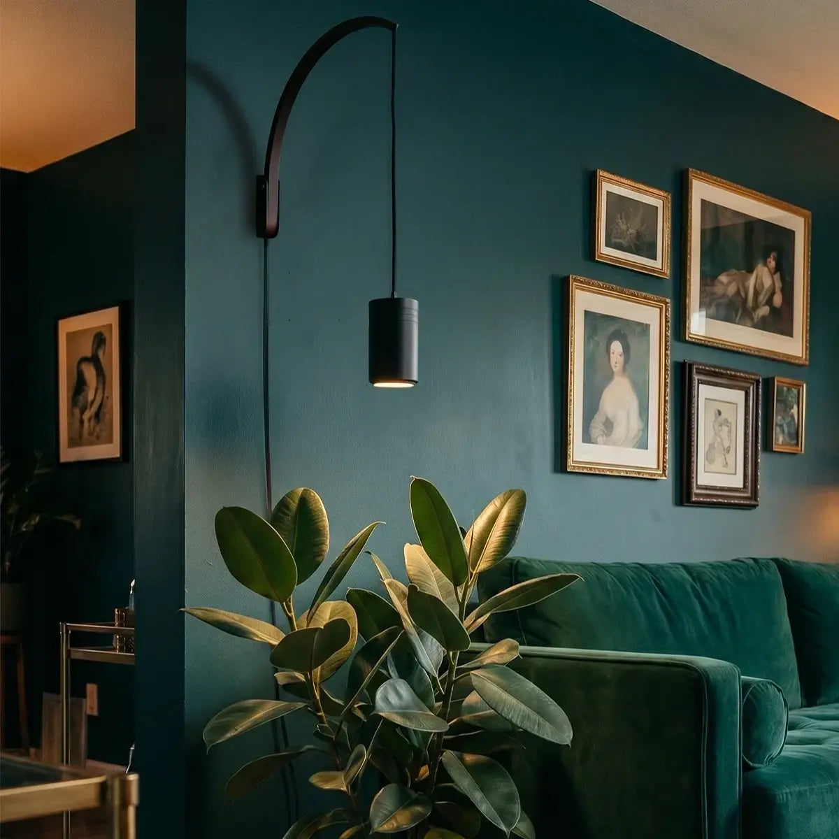 Soltech Luna dark wooden wall arm holding a pendant grow light suspended above a potted indoor houseplant.