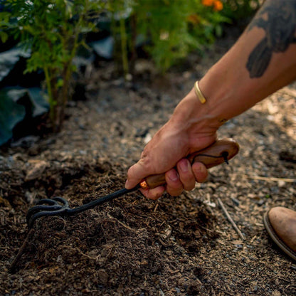 The Barebones Cultivator rakes through dense, rocky soil and remove weeds with ease.