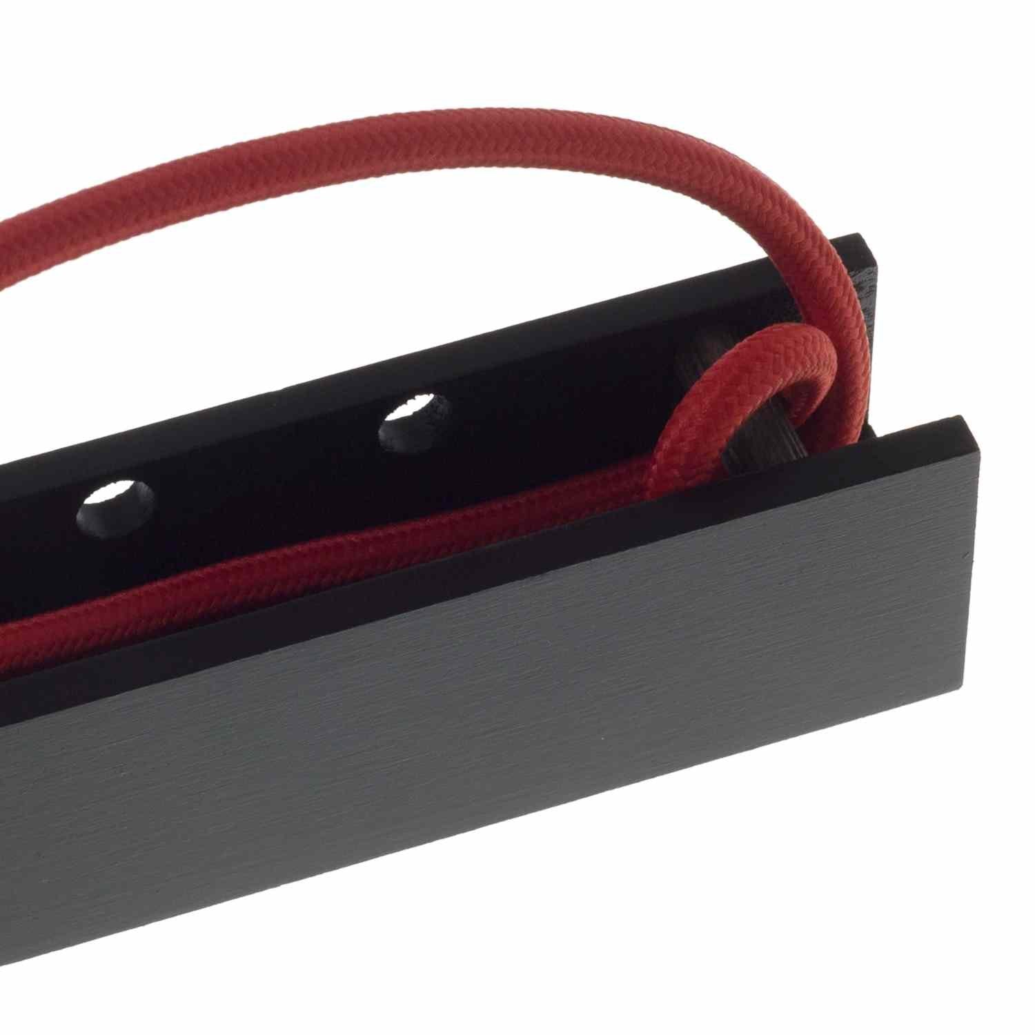 Lamp Cord Wrapping Around Black Pinocchio Wall Mount